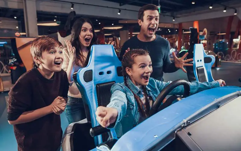 A family celebrating after winning at an arcade in CT.