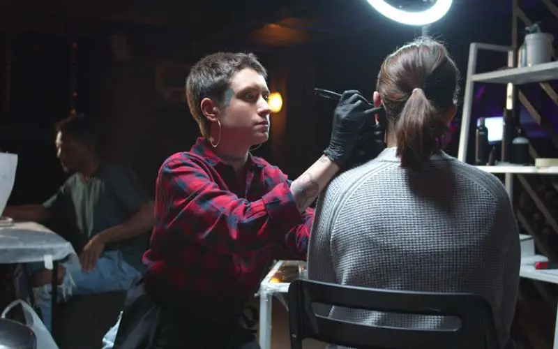 Girl getting her ear pierced in CT.