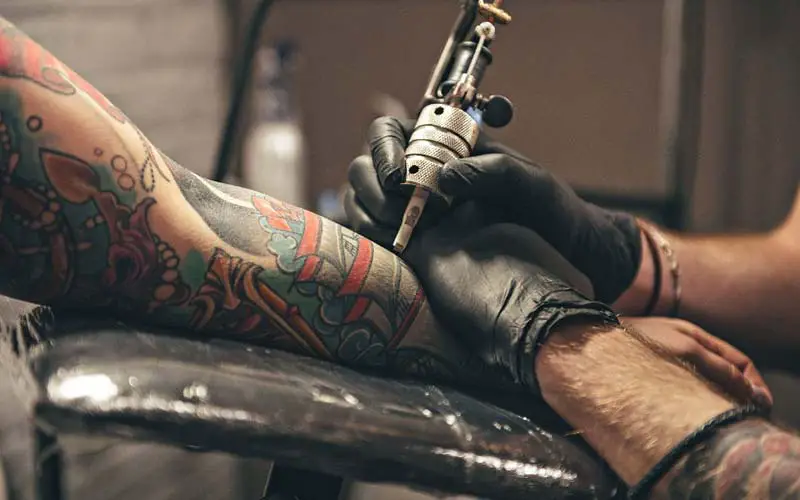 Man getting a tattoo at a tattoo shop in CT.