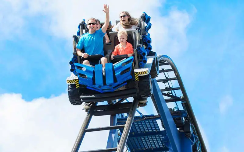 A family on a roller coaster ride at an amusement park in CT.