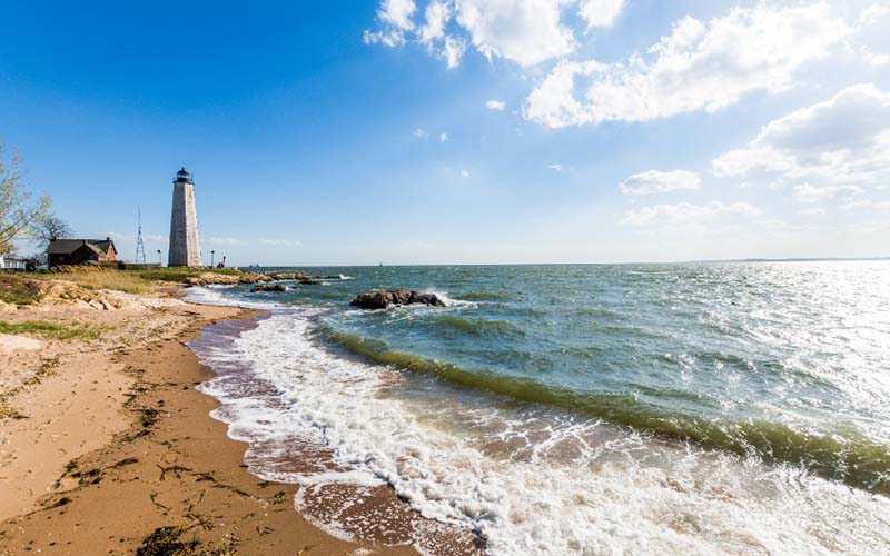 Lighthouses on the beach, which should be included on every travel itinerary for vacations or trips to Connecticut