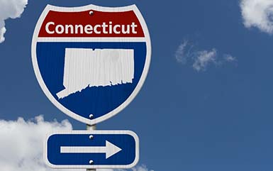 A sign pointing towards what Connecticut is known for.