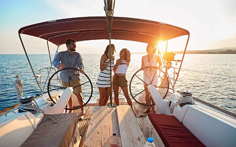 Friends on a boat in Connecticut, which is a stereotype.