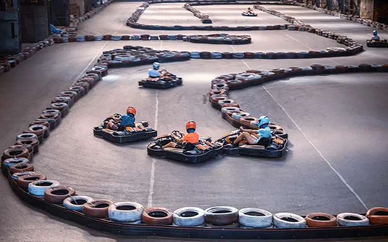 A group of friends racing go karts in CT.