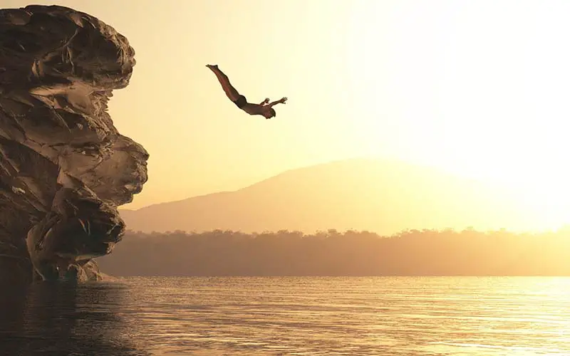 A person cliff jumping in CT.