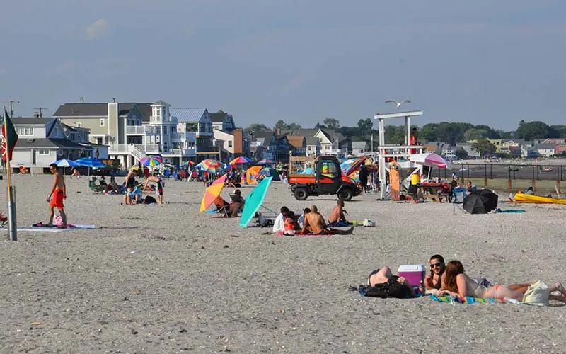 People at a public beach in CT.