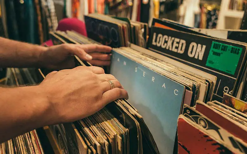 People sorting through vinyl records at a record store in CT.