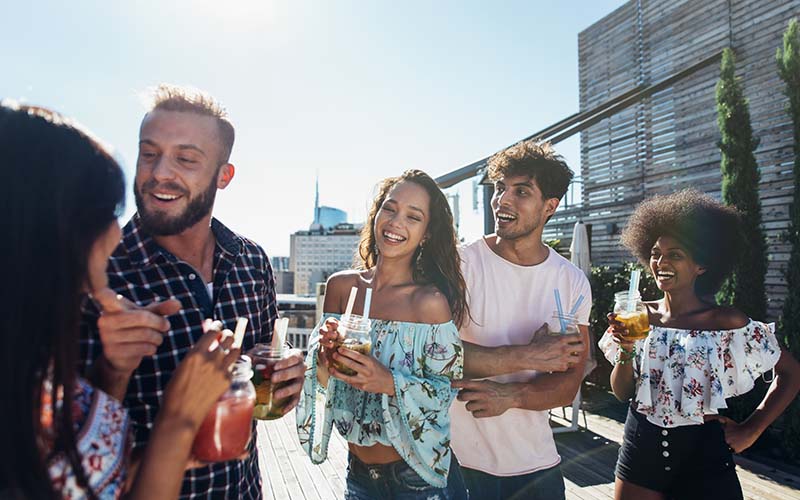 People drinking at a rooftop bar in CT.